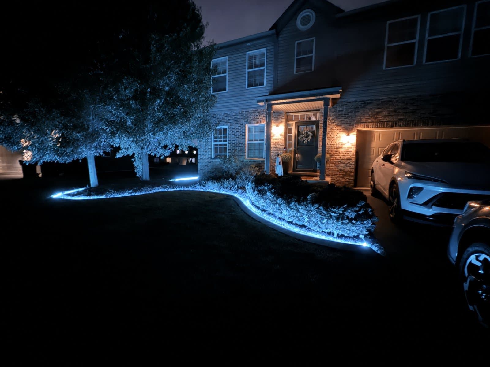 Concrete curb lit blue at night
