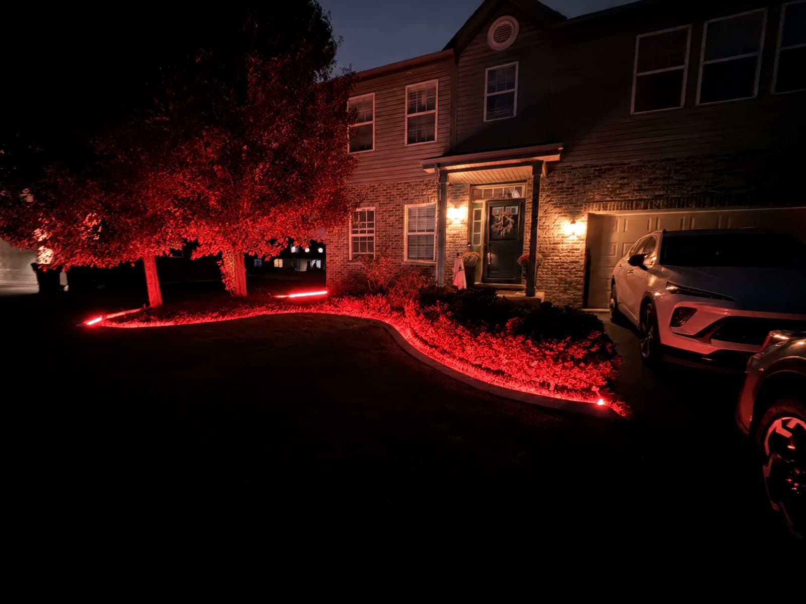 Concrete curb lit red at night