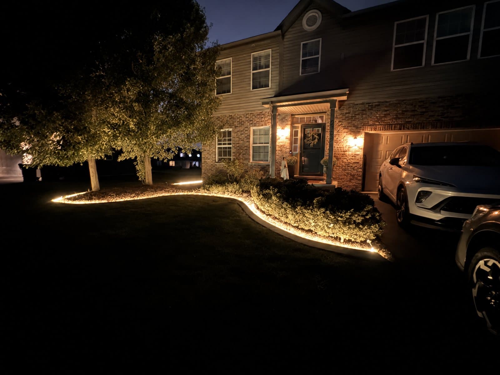 Concrete curb lit warm white at night